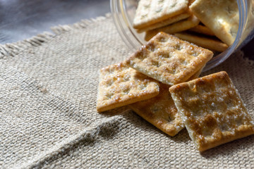 Biscuits on wooden background with selective focus and crop fragment