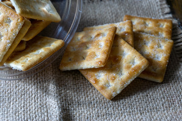 Biscuits on wooden background with selective focus and crop fragment