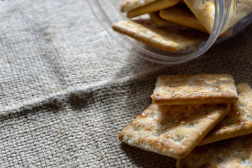 Biscuits on wooden background with selective focus and crop fragment