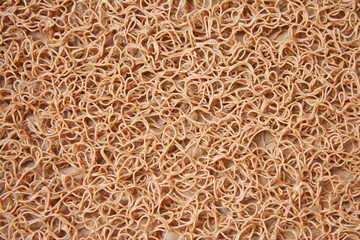 Plastic rubber carpet in seamless patterns abstract brown background top view