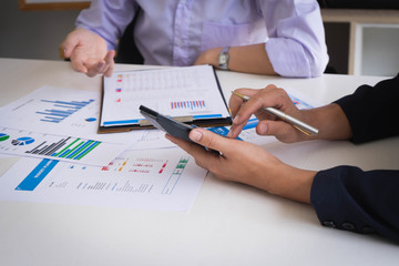 Business people meeting to analyze and discuss the situation on the financial report in meeting room. Meeting planning budget and cost. Business financial analysis and strategy concept.