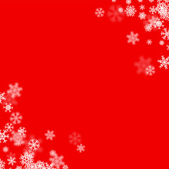 Christmas snow background with scattered snowflakes falling in winter