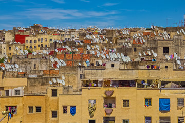 View of ancient rooftops of the Fes medina with satellite dishes
