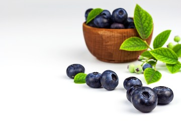 Fresh blueberries on a white background. Healthy summer fruit. Taste of summer. Growing of blueberries. Advertising on blueberries.