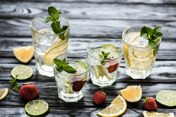 strawberry mojito.close-up view of glasses with fresh cold summer cocktails on wooden table.close-up view of glasses with fresh cold summer cocktails on wooden table.close-up view of glasses 