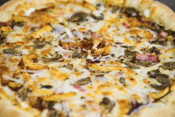 round carbonara pizza with Mozzarella cheese on an old wooden table