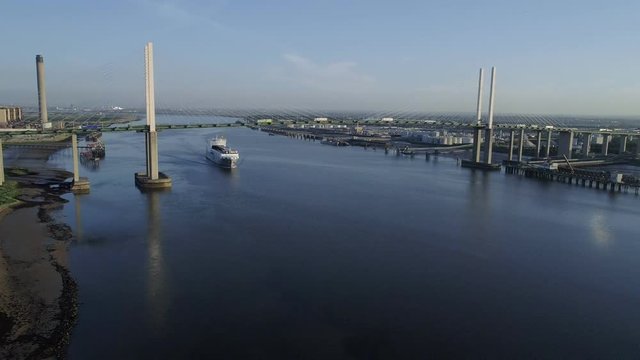Drone descends towards ro-ro cargo ship Adeline as it passes under Queen Elizabeth II Bridge