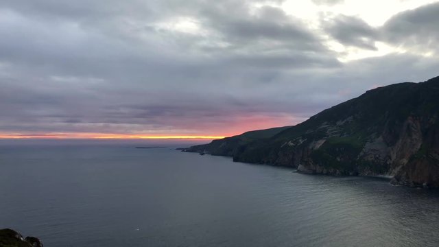 Slieve League's cliffs at sunset. It is a mountain on the Atlantic coast of County Donegal, Ireland. At 601 metres it has some of the highest sea cliffs on the island of Ireland