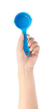 hand holding Plastic scoop isolated on white background