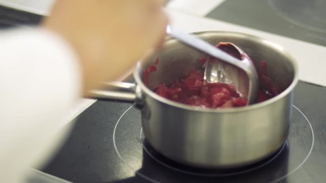 The borsch boils on the stove