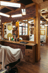 stylish illuminated barbershop with modern interior