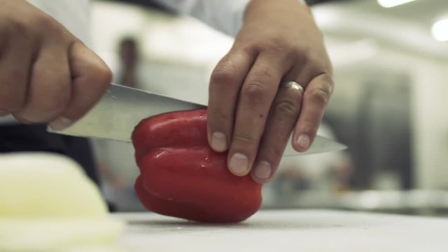 Chef cuts bulgarian pepper