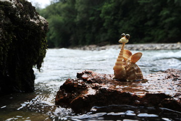 Image of a dragon made of shells. Handmade.