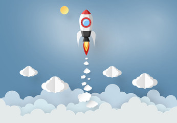 Leadership and Business concept with Origami made paper Rocket flying in the sky. paper art design and craft style.
