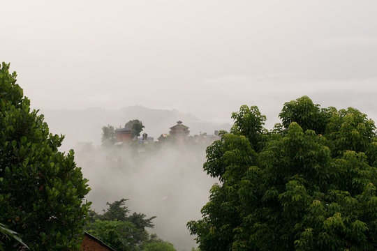 Nuwakot ancient castle tower appears in the morning haze from a hilltop near Nuwakot village, Nepal.