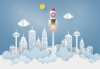 startup and Business concept with Origami made paper Rocket flying in the sky. paper art design and craft style.