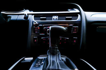 Modern Luxury sport car inside. Interior of prestige car. Black Leather. Car detailing. Dashboard....