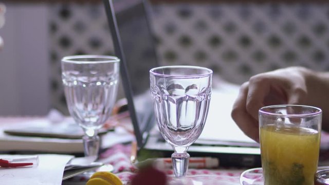 Man drinks his compote in cafe