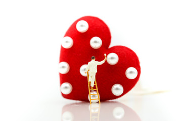 Miniature people: Workers brush painting Red heart,celebrate valentines'day or wedding anniversary  concept.