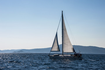 Fototapeta na wymiar Sailboat sailing among the many beautiful islands of Croatia. Hvar, Brac, Vis, Korčula.