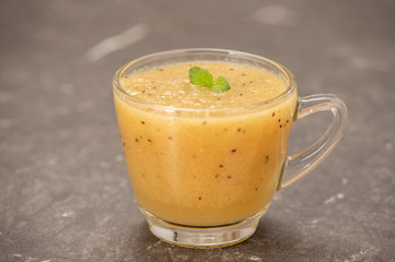 Tropical fresh fruit set and juice smoothies isolated with wooden background