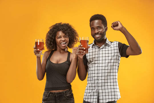 The Afro Couple Or Happy Young People Laughing And Drinking Beer At Studio