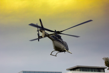 Light helicopter when landing on helipad on roof of house