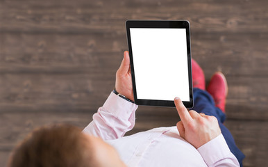 Man holding tablet. Tablet vertical screen mockup.