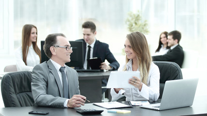 Fototapeta premium employees using digital tablet to work with financial data