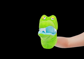Hand wearing Crocodile puppets with copy space isolated on black background, Crocodile head.