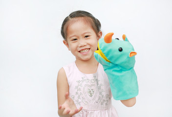 Adorable little Asian child girl hand wear and playing Rhinoceros puppets on white background.