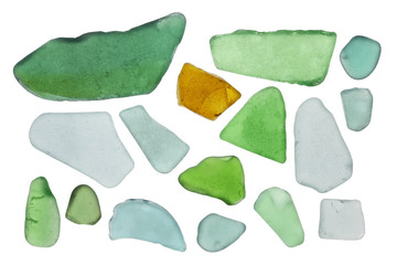 Pieces of colored bottle glass are turned in waves of the Baltic Sea