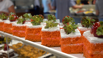 Restaurant Buffet. In the foreground there are plates with dessert.