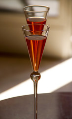 two beautiful glasses with orange cocktails