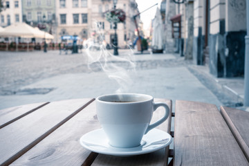 street cafe in Europe, cup of coffee on cozy vintage cafe terrace