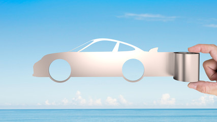 Hand holding metal roller sheet in sport car shape with blue sky and sea background, concept of energy saving.