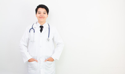 Soft focus. asian doctor smiling look to camera with stethoscope on gray background.