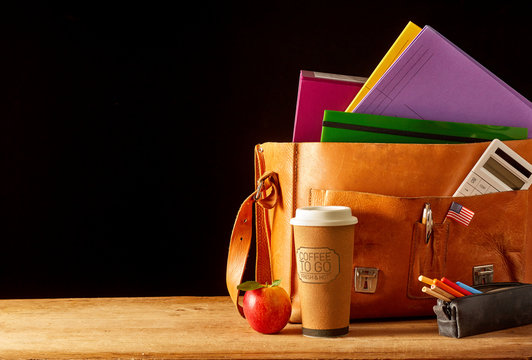 School or office supplies and leather satchel