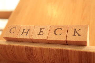 Wooden Block Text of Check