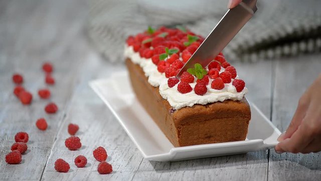 Raspberry Cake for holidays. Cutting Raspberry Cake