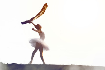 Fototapeta premium Ballerina posing in tutu outside