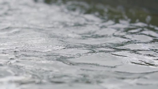 Water texture, surface water in fountain. Close up, dynamic scene, 50fps, toned video.