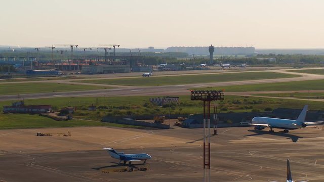 The airport infrastructure with its runways, parking places with airplanes and the constructed a new airport building Pulkovo
