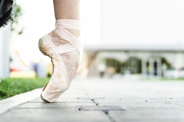 Feet of ballerina in pointe shoes