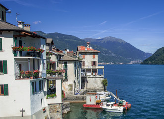 loading and unloading of building materials at a construction site. Como Lake, Italy