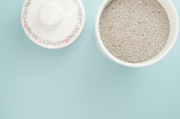 salvia hispanica seeds in a porcelain jar - colors and objects backdrops