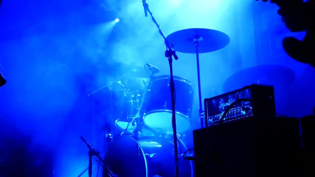 Drummer and Drum kit lit up blue on stage at Festival Manchester UK