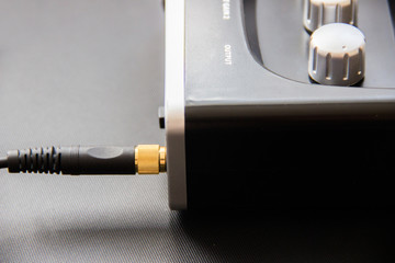 Headphone cable in the headphone jack. external sound card,mixer in home studio of musician