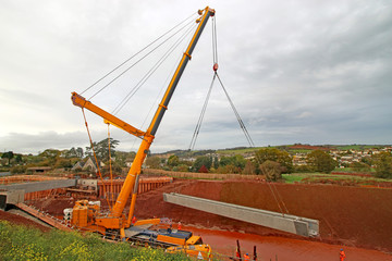 Crane lifting a bridge beam