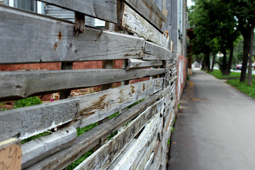a wooden fence is standing in the street